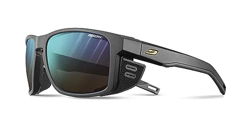 Julbo Shield Reactiv 2-4 - Hochgebirgsbrille schwarz-schwarz - Sportbrille mit Reactiv 2-4 Gläsern für optimalen UV-Schutz und Selbsttönung. Ideal für anspruchsvolle Bergtouren, mit herausragendem Antibeschlagschutz und stylishem Design.