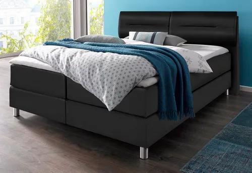 Boxspringbett MAINTAL, schwarz, Kunstleder, 180x200 cm - Polsterbetten mit 7-Zonen-Tonnentaschen-Federkernmatratze für ergonomischen Schlafkomfort. Inklusive Kaltschaum-Topper für zusätzlichen Liegekomfort und Pflegeleichtigkeit.