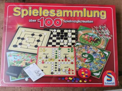 Schmidt Spiele 49147 - Spielesammlung mit 100 Spielmöglichkeiten - Gesellschaftsspiele für 2 oder mehr Spieler, ideal für Familienabende und bietet eine abwechslungsreiche Spielauswahl von Klassikern bis zu modernen Spielen.