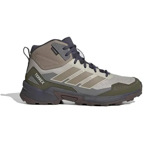 ADIDAS Herren Multifunktionsschuhe Terrex Eastrail 3 Mid Climaproof - Erlebe mit den Terrex Eastrail 3 Mid Climaproof Wanderschuhen ultimativen Komfort und Halt auf jedem Trail. Das atmungsaktive Obermaterial und die innovative Technologie sorgen für trockene Füße, egal wohin dein Abenteuer führt.