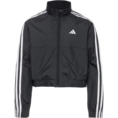 adidas TRAIN ESSENTIALS 3 STRIPES Kurzjacke für Mädchen - Modische Kurzjacke aus leichtem, strapazierfähigem Material mit AERO.RDY-Funktion; feuchtigkeitsregulierend und atmungsaktiv, perfekt für sportliche Aktivitäten.