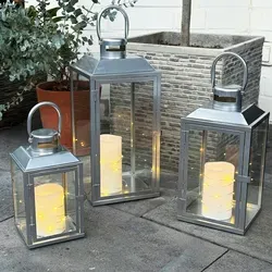 3er Set Gartenlaternen - Metall Windlicht Silber H24/33/41cm - Elegantes 3er Set Gartenlaternen aus pulverbeschichtetem Metall, wetterfest und ideal für stimmungsvolle Beleuchtung im Freien. Perfekt für Gartenpartys oder romantische Abende!