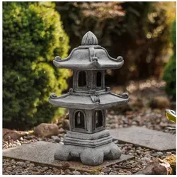 Zweistöckige japanische Steinpagode in grau von gartendekoparadies