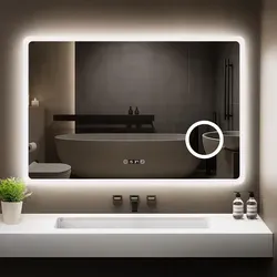 GIMBELEN LED Badezimmer Spiegel mit Uhr 100 x 60 cm – Dimmbar, Antibeschlag und 3 Lichtfarben - Moderner Badezimmer Spiegel mit 3-fach Vergrößerung und integrierter Uhr. Die dimmbare Beleuchtung in drei Farbtemperaturen sorgt für optimale Lichtverhältnisse. Ideal für präzise Pflege im Bad.