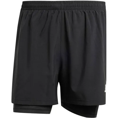 ADIDAS Herren Shorts Own the Run CLIMACOOL 2-in-1 - Laufsport Shorts mit CLIMACOOL Technologie für optimale Feuchtigkeitsregulation, integrierte Leggings für weniger Reibung und praktische Reißverschlusstasche für dein Smartphone.