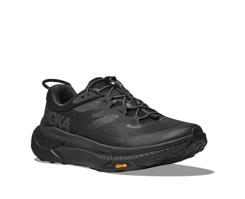 Herren Laufschuhe TRANSPORT GTX 46,5EU - Vielseitiger Sneaker - Der TRANSPORT GTX von HOKA ist ideal für den urbanen Alltag. Mit wasserdichtem GORE-TEX und Vibram Megagrip-Außensohle bietet er optimalen Komfort und Traktion. Schnellschnürsystem für müheloses An- und Ausziehen.