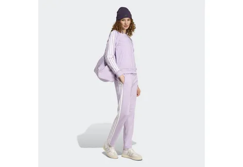 adidas Sportswear Trainingsanzug W ESS 3S TS (2-tlg) lila L (42/44) - Sportliche Trainingsbekleidung aus 100% Polyester, ideal für Läuferinnen. Der bequeme Regular Fit sorgt für optimale Bewegungsfreiheit.