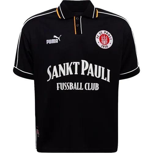 PUMA FC St. Pauli Retro Trikot schwarz-weiß für Herren, Größe S - Stylisches Retro-Trikot von PUMA mit auffälligem Schriftzug auf der Brust. Ideal für Fans und Modebewusste, die ihren Support zeigen möchten.