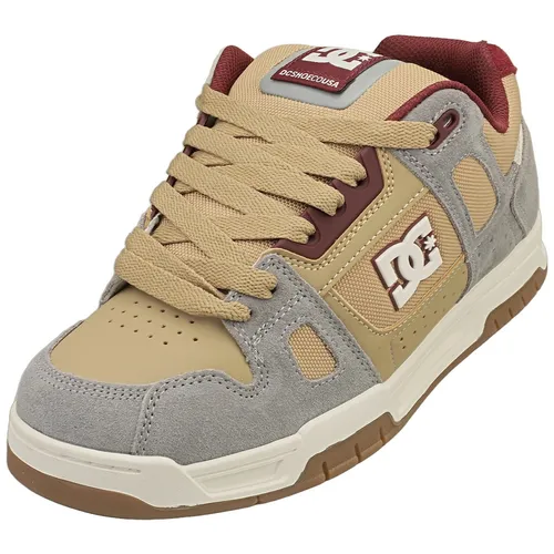 DC Shoes Stag Herren Skate Sneaker in Tan Grau - 40.5 EU - Stylischer Skate Sneaker für Herren mit robustem Obermaterial aus Leder und Synthetik. Ideal für den Alltag und Freizeitaktivitäten, bietet optimalen Tragekomfort und eine rutschfeste Gummisohle.