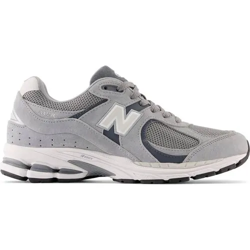 New Balance Herren Sneaker 2002R mit Leder 44,5EU - Sportive Sneakers mit komfortabler Dämpfung und klassischer Schnürung, ideal für Alltag und Freizeit.