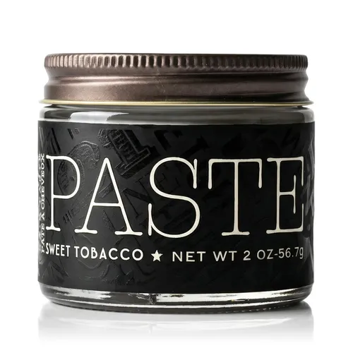 18.21 Man Made Paste 59ml - Haarstyling-Produkt mit mittlerer Verstärkung, seidenmatt glänzend und frei von Parabenen. Ideal für lockiges und gewelltes Haar, spendet Feuchtigkeit und kontrolliert Frizz für jeden gewünschten Stil.
