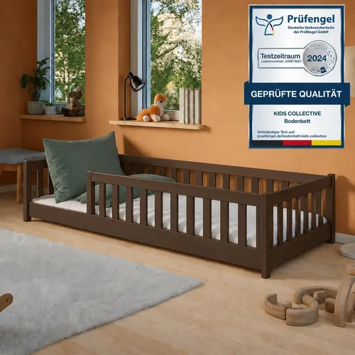 Montessori Kinderbett Bodenbett 80x180 cm mit Rausfallschutz in Zartbitterschokolade - Dieses stilvolle Montessori Bodenbett fördert die Selbstständigkeit Ihres Kindes. Mit einem robusten Kiefernholzrahmen und abgerundeten Kanten bietet es Sicherheit und Komfort für einen ruhigen Schlaf.