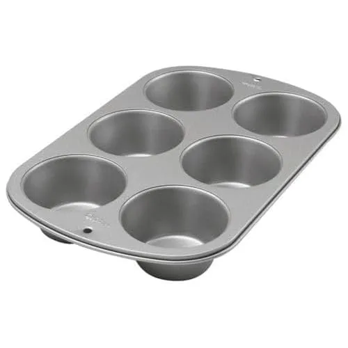 Wilton Recipe Right Jumbo Muffin Backform 6er Set - Hochwertige Aluminium-Backform für 6 Jumbo-Muffins, ideal für köstliche Backergebnisse. Perfekte Größe für große Muffinförmchen (8,5 cm Durchmesser) und leicht zu reinigen.