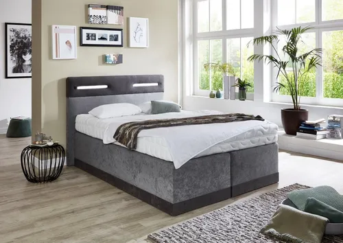 Westfalia Schlafkomfort Boxspringbett mit LED-Beleuchtung - Genieße höchsten Schlafkomfort mit diesem stilvollen Boxspringbett von Westfalia. Die dimmbare LED-Beleuchtung im Kopfteil sorgt für Gemütlichkeit, während die hochwertige Matratzenkombination perfekten Support bietet. Ideal für dein Zuhause!