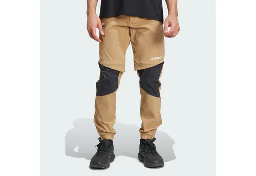 ADIDAS Herren Hose TERREX Utilitas Hiking Zip-Off - Wanderhose mit abnehmbaren Beinen, ideal für wechselnde Wetterbedingungen. Robuste, wasserabweisende Beschichtung sorgt für schnelle Trocknung und Bewegungsfreiheit.