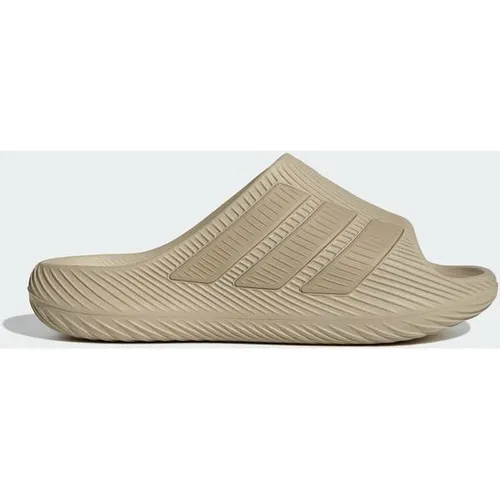 ADIDAS PURECHILL SLIDES - Genieße besten Komfort mit den Purechill Slides von adidas. Ideal für Freizeit und Stadtbummel, bieten sie eine dämpfende EVA-Zwischensohle und eine rutschfeste Gummiaußensohle für sicheren Halt und lässigen Style.