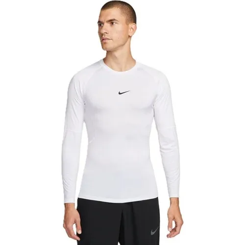 NIKE Herren Sweatshirt M NP DF TIGHT TOP LS – Enganliegendes Langarm-Oberteil - Das Nike Pro Langarm-Oberteil bietet ein geschmeidiges Tragegefühl und hohen Komfort für dein Training. Ideal für verschiedene Sportarten und mit abgerundetem Saum für zusätzlichen Schutz.
