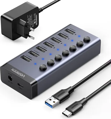 Ugreen Multifunktions-Hub 7in1 USB Typ C - USB-Hub mit 7x USB 3.0-Anschlüssen für blitzschnelle Datenübertragung und effizientes Aufladen, elegantes graues Design für jedes Büro.
