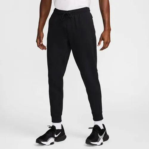 NIKE Herren Sporthose Primary Dri-FIT UV Versatile - Fitnesshosen aus schweißableitendem Dri-FIT Material, ideal für aktive Männer, die Komfort und Bewegungsfreiheit schätzen.