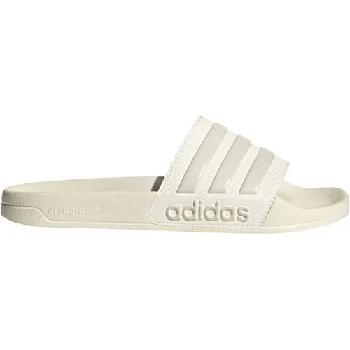 adidas ADILETTE SHOWER Badelatschen in owhite-alumin-owhite, Größe 40 2/3 - Stylische Badelatschen mit 3-Streifen-Design, weichem CloudFoam für hohen Tragekomfort und rutschfester Sohle. Ideal für Pool und nach dem Duschen.
