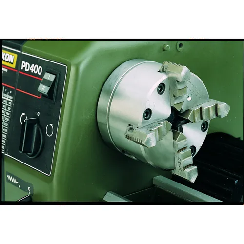 Proxxon Vierbacken-Drehfutter für PD 400 - Zentrisch Spannend - Drehmaschinen, zentrisch spannendes Vierbacken-Drehfutter für die PD 400 mit hoher Spanngenauigkeit und automatischer Zentrierung.