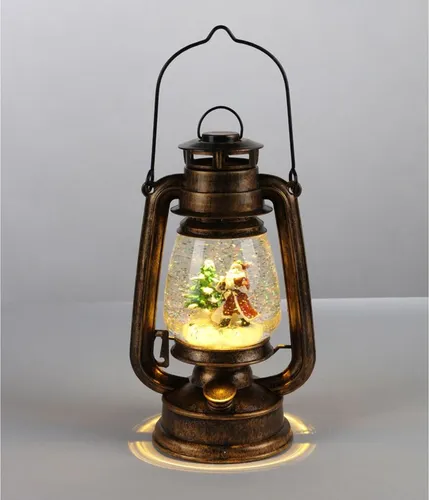 LED-Petroleumlampe Weihnachtsmann 34,5cm - Nussknacker Weihnachtsbeleuchtung in Form eines Weihnachtsmanns, freistehend und zaubert festliche Stimmung mit Schneekugel-Effekt.