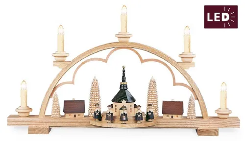 Müller Schwibbogen Kurrende - Schwibbogen aus Holz mit Kurrendefiguren, 57 x 12 x 32 cm, bringt Erzgebirgsromantik ins Zuhause und erleuchtet die Seiffener Kirche mit elektrischen Kerzen.