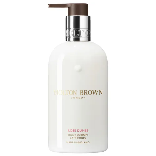 Molton Brown Rose Dunes Body Lotion 300 ml - Luxuriöse Ganzkörperpflege für alle Hauttypen, spendet intensive Feuchtigkeit und umhüllt Sie mit einem blumigen, exotischen Duft. Die praktische Pumpflasche sorgt für eine einfache Anwendung.