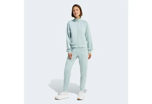 adidas Sportswear Trainingsanzug W FEELCOZY TS (2-tlg) XL (46/48) - Sportlicher 2-teiliges Set für optimalen Tragekomfort beim Laufen. Hergestellt aus 100% Polyester, maschinenwaschbar und in sportlicher Passform für aktive Tage.