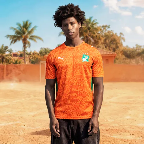 PUMA Trainingsshirt Elfenbeinküste 2026 Heimtrikot Herren orange L (52/54) - Stylisches Trainingsshirt für Fußballfans, hergestellt aus 100% Polyester. Mit feuchtigkeitsregulierender dryCELL-Technologie für optimalen Tragekomfort. Ideal für Training und Freizeit.