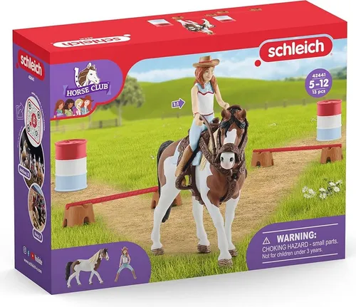 Schleich Horse Club Hannahs Western Reitset - Entdecke das spannende Barrel Racing mit Hannahs Western-Reitset von Schleich! Das Set enthält detailgetreue Figuren, Hindernisse und farbige Fässer für kreative Spielmöglichkeiten. Ideal für kleine Pferdefans ab 5 Jahren.