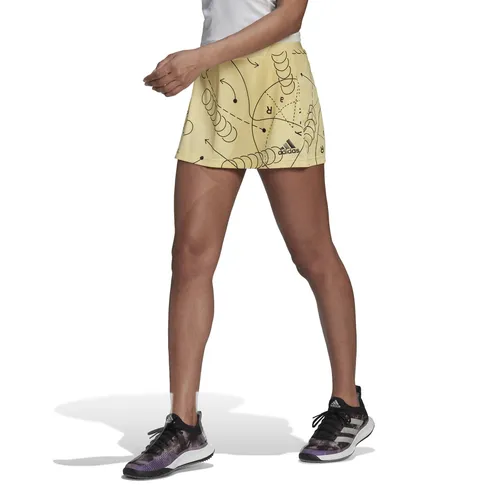 adidas Tennisrock Club Graphic Aeroready (integrierte Tight mit Balltaschen) gelb Damen, Größe: XL - Feuchtigkeitsabsorbierender Tennisrock mit integriertem Tight für optimalen Tragekomfort. Ideal für dein Spiel, bietet er ein stylisches geometrisches Design und unterstützt nachhaltige Materialien.