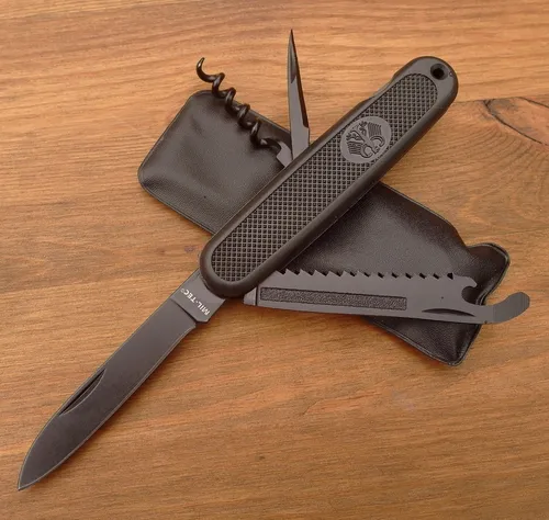 MILTEC BW Taschenmesser A.A. Schwarz - Multifunktional mit Säge und Flaschenöffner - Taschenmesser in Schwarz, mit Säge, Ahle und Flaschenöffner. Ideal für Outdoor-Aktivitäten und Camping.