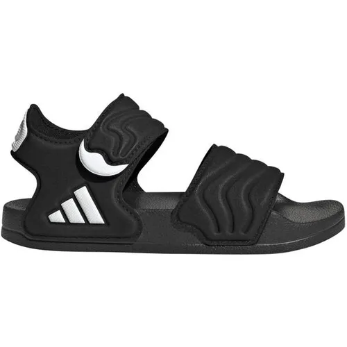 adidas ADILETTE Sandale für Kinder in Grün - Größe 38 EU - Bequeme adidas ADILETTE Sandale für Kinder in Core Black und Cloud White. Ideal für den Alltag und Freizeit, bietet hohen Tragekomfort und stylisches Design.