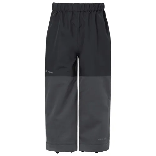 Vaude Kid's Caprea Rain Pants - Wasserdichte Regenhose für Kinder - Regenhose in Grau/Schwarz, Größe 134/140; wind- und wasserdicht, ideal für den Alltag. Perfekt für aktive Kinder, die auch bei schlechtem Wetter trocken bleiben wollen.
