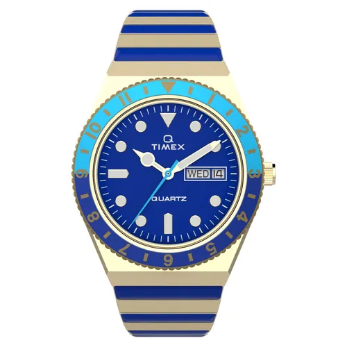 Timex Q Malibu Damenuhr TW2V38500 - Elegante Armbanduhr für Damen mit Quarzwerk, blauem Zifferblatt und goldenen Akzenten. Ideal für selbstbewusste Frauen, die auch in dunklen Räumen die Zeit ablesen möchten.