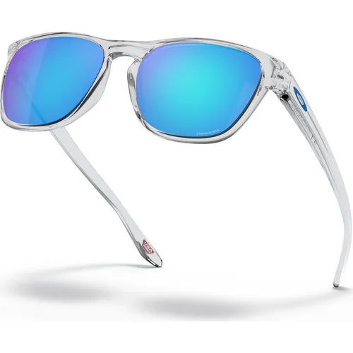 Oakley Manorburn Polished Clear Prizm Sapphire Sportbrille - Sportbrillen mit Prizm Gläsern für verbesserte Farben und Kontraste. Leichter O Matter-Rahmen und individuelle Nasenpads bieten hohen Tragekomfort und optimale Sicht.