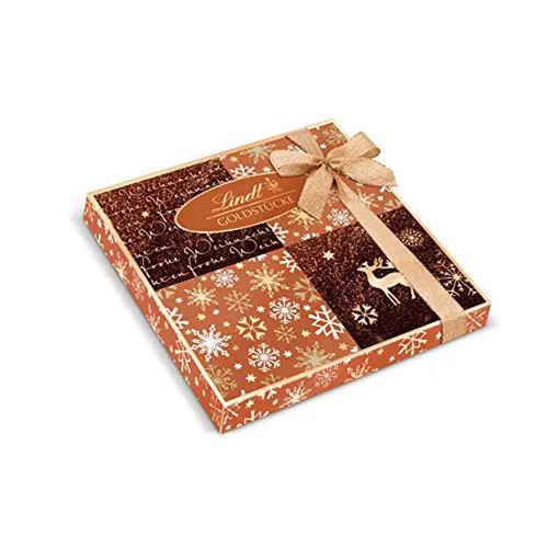 LINDT Goldstücke Rose Pralines 300g - Exquisite Schokolade in Geschenkverpackung, ideal für Weihnachten. Genießen Sie den luxuriösen Geschmack der Roségoldstücke Pralinés von Lindt.