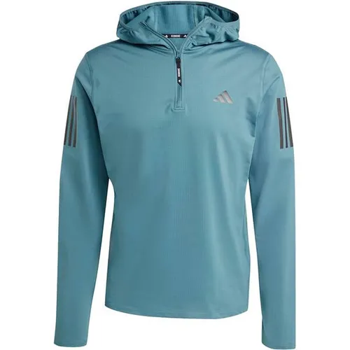 adidas Herren Own The Run Winterized Hooded Half-Zip, Preloved Teal, S - Schmal geschnittenes Shirt aus 88 % recyceltem Polyester und 12 % Elasthan mit CLIMAWARM-Technologie für optimale Wärme und Komfort beim Laufen.