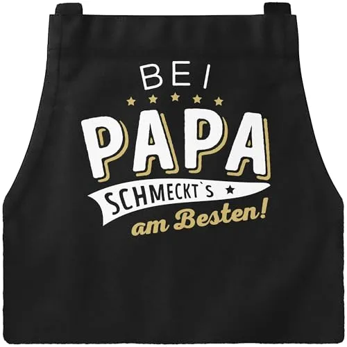 MoonWorks® Kochschürze Grill-Schürze für Männer und Frauen mit Spruch Bei Papa bzw Mama schmeckts am besten! Baumwoll-Schürze Küchenschürze schwarz unisize