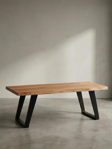 Massiver Akazien Couchtisch 120x60 cm mit Baumkante - Eleganter Couchtisch aus Akazie Massivholz mit einzigartiger Baumkante, handgefertigt und ein Unikat. Stabilität durch U-förmige Metallbeine, ideal für jedes Wohnzimmer.