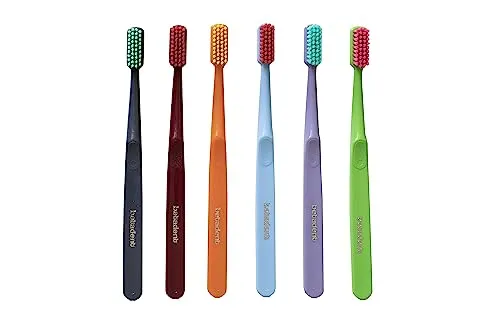 Betadent Medium-Bürste – mittlere Borsten mit abgerundeten Spitzen für eine sanfte und dennoch effektive Anti-Plaque-Wirkung, verschiedene Farben.