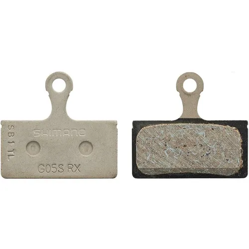 SHIMANO Bremsbeläge G05S Resin ohne Kühlrippen - Original SHIMANO Bremsbeläge G05S aus Kunstharz für hohe Bremsleistung. Ideal für Shimano Scheibenbremsen, bieten weniger Geräuschentwicklung und eine verbesserte Haltbarkeit von 50% gegenüber Vorgängermodellen.