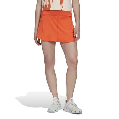 adidas Tennisrock Match HEAT.RDY (integrierte Tight, breiter Bund) orange Damen, Größe: XL - Sportlicher Tennisrock mit Recycling-Anteil und integrierter Tight für optimalen Tragekomfort. Die HEAT.RDY Technologie sorgt für ein frisches Gefühl, während der schmale Schnitt Bewegungsfreiheit bei jedem Match garantiert.