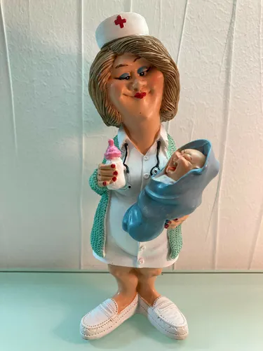 Freundliche Krankenschwester mit Baby auf dem Arm und Flasche Vogler 841-1005