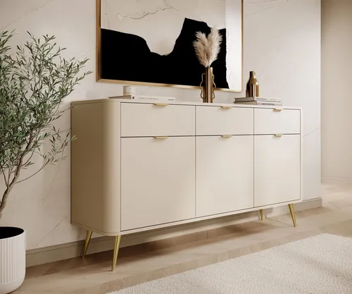 Selsey Sideboard Beige mit 3 Schubladen - Elegantes Sideboard für Wohnzimmer, mit abgerundeten Kanten und goldenen Metallfüßen für einen modernen Look. Vielseitiger Stauraum in drei Schubladen und hinter Türen, ideal für jeden Raum.