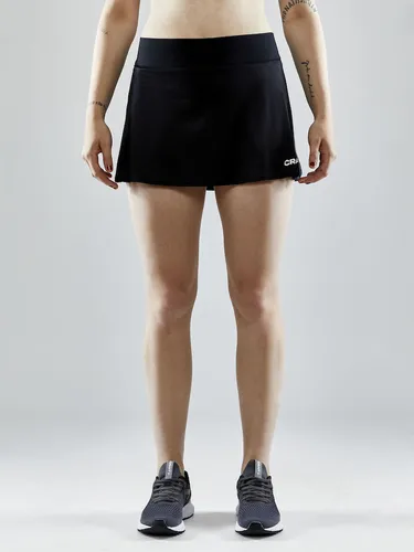 Craft Sport-Rock Squad Skirt - Funktioneller Trainingsrock für Damen, Größe: XL, schwarz - Der Squad Skirt ist ideal für Sportlerinnen. Aus leichtem, funktionellem Material für besten Feuchtigkeitstransport und optimale Bewegungsfreiheit. Der breite Hüftbund sorgt für hohen Tragekomfort.