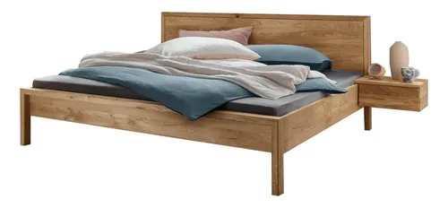 Doppelbett Aalbe 180x200 aus massiver Wildeiche - Robustes Doppelbett mit großzügiger Liegefläche von 180x200 cm, gefertigt aus hochwertiger Wildeiche. Das elegante Holzkopfteil verleiht jedem Schlafzimmer einen natürlichen Charme.