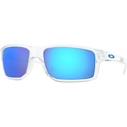 Oakley Gibston Sportbrille Polished Clear / Prizm Sapphire - Sportbrillen mit hochwrap Design für umfassenden Schutz und Komfort. Prizm Linsen verbessern Farben und Details, ideal für aktive Sportler.