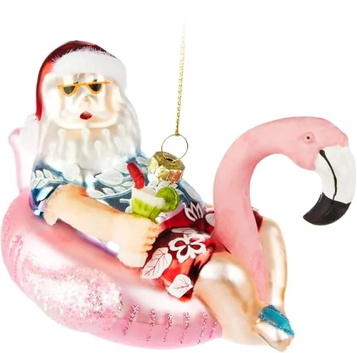 BRUBAKER Weihnachtsmann Macht Urlaub - Handbemalte Weihnachtskugel aus Glas - Santa auf Flamingo Schwimmring Rosa mit Sonnenbrille und Cocktail - Christbaumschmuck Figur - Lustige Baumkugel - 12 cm